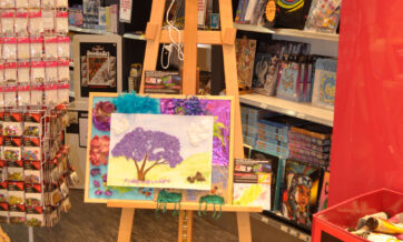 Gorgeous Tactile Artwork, created by Jill Huber, and mounted on a background of arrangements from the Tactile art workshop. This piece is installed at Eckersleys Art shop in Westfield Penrith.