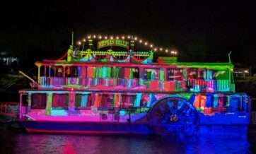 Bright projections light the surface of the vintage paddle steamer the Nepean Belle.