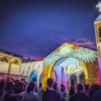 Audience gathering to witness “A Saint in the Neighbourhood” — a shared celebration of light, peace, and cultural connection.